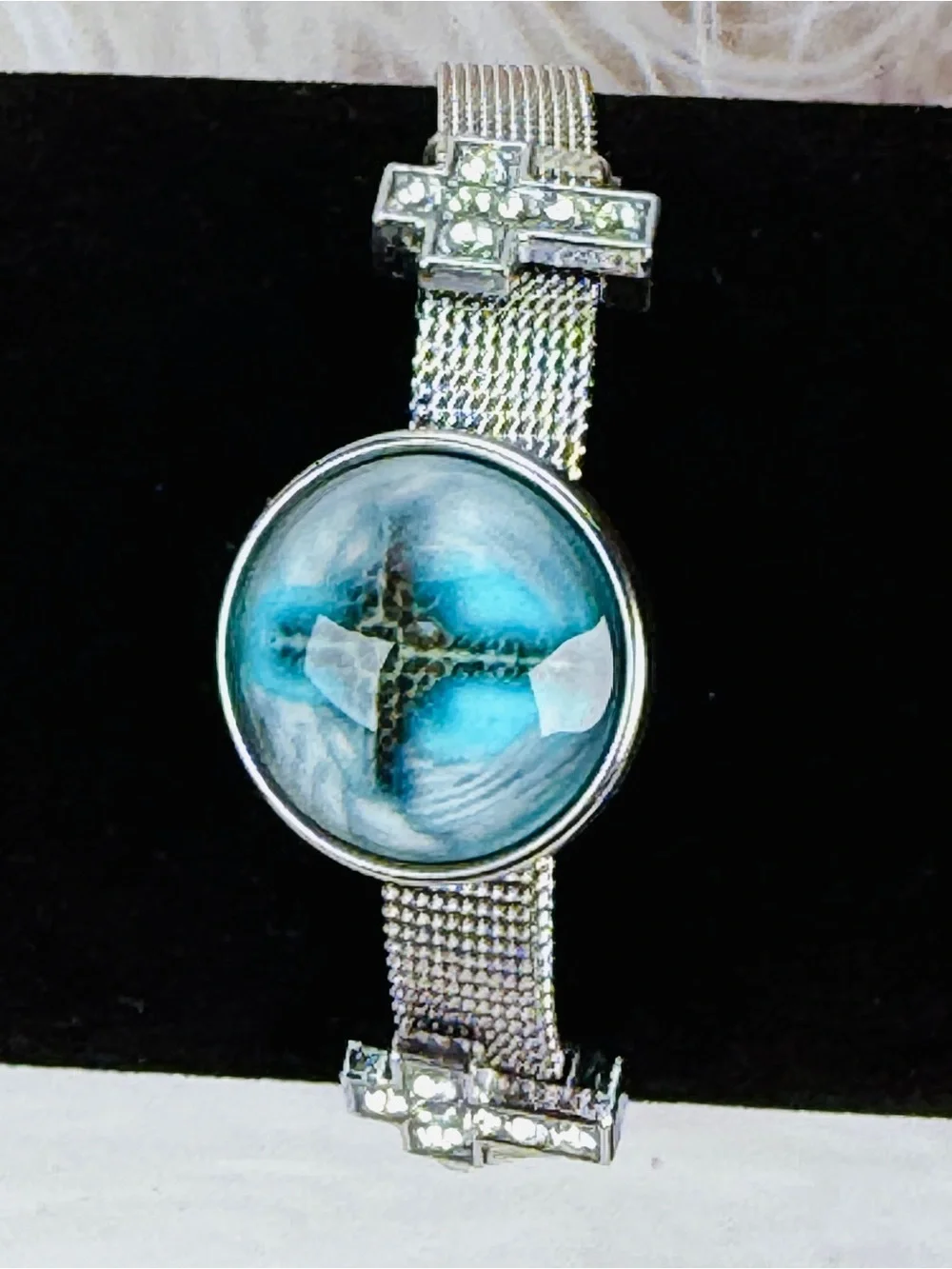 Silvertone Mesh Snap Bracelet with Blue Cross Design